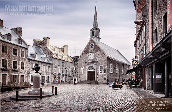 Stock photo of Place Royale Notre-Dame-des-Victoires Roman Catholic Church in Old Quebec City on a rainy day Buy commercial use license at MaximImages
