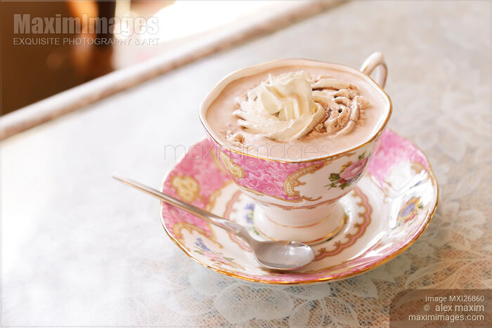 Porcelain cup of hot chocolate with cream Stock photo of Porcelain cup of hot chocolate with cream Buy commercial use license at MaximImages