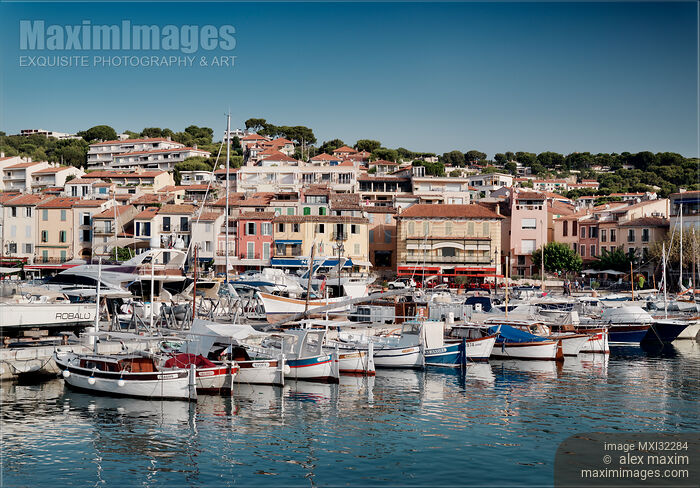 Stock photo of Port town of Cassis harbour boats in a quay city skyline scenery France South Buy commercial use license at MaximImages