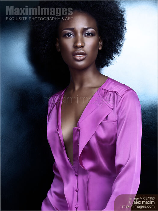 Stock photo of Portrait of a beautiful african american woman with shiny silvery skin Buy commercial use license at MaximImages