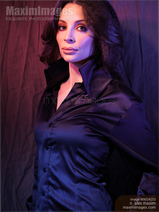 Stock photo of Portrait of a beautiful woman in black blouse Buy commercial use license at MaximImages