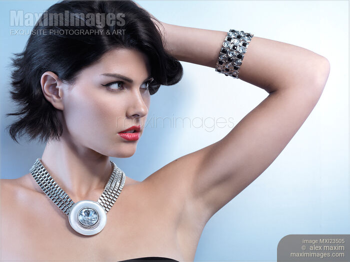 Portrait of a Beautiful Woman Wearing Jewellery Stock photo of Portrait of a Beautiful Woman Wearing Jewellery Buy commercial use license at MaximImages