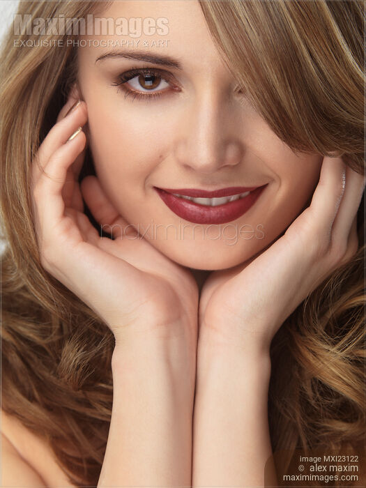 Portrait of a Beautiful Young Smiling Woman Stock photo of Portrait of a Beautiful Young Smiling Woman Buy commercial use license at MaximImages