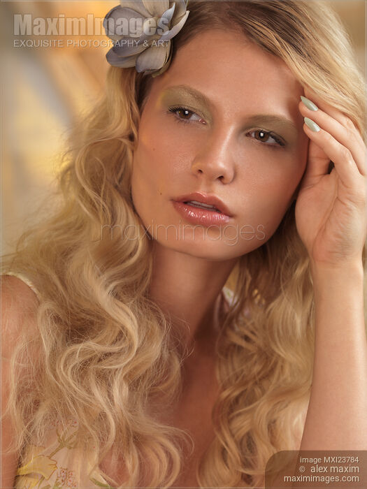 Portrait of a Beautiful Young Woman Stock photo of Portrait of a Beautiful Young Woman Buy commercial use license at MaximImages