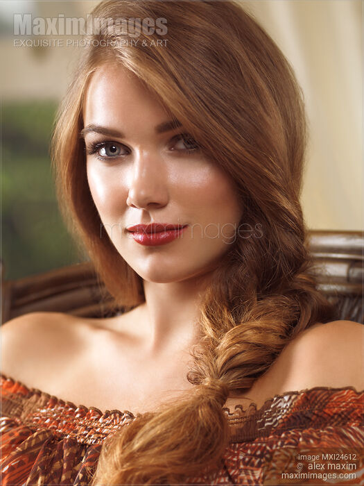Portrait of a beautiful young woman with a braid Stock photo of Portrait of a beautiful young woman with a braid Buy commercial use license at MaximImages