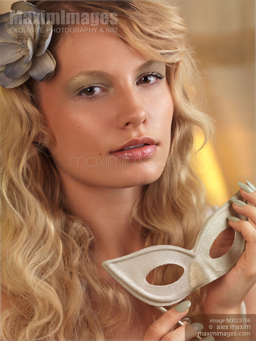Portrait of a Beautiful Young Woman with a Mask Stock photo of Portrait of a Beautiful Young Woman with a Mask Buy commercial use license at MaximImages