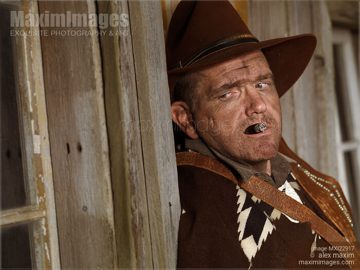 Portrait of a Cowboy Smoking a Cigar Stock photo of Portrait of a Cowboy Smoking a Cigar Buy commercial use license at MaximImages