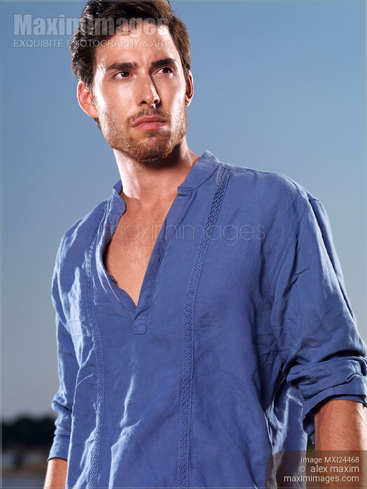 Portrait of a man in blue shirt Stock photo of Portrait of a man in blue shirt Buy commercial use license at MaximImages