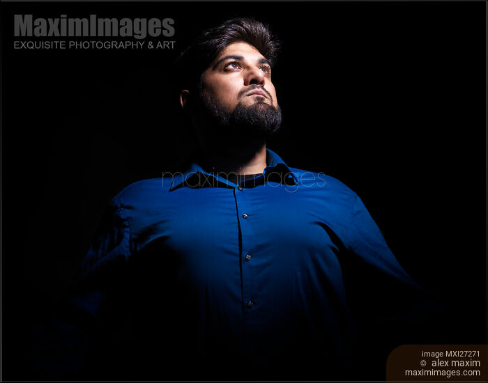 Stock photo of Portrait of a man looking up at the light Buy commercial use license at MaximImages