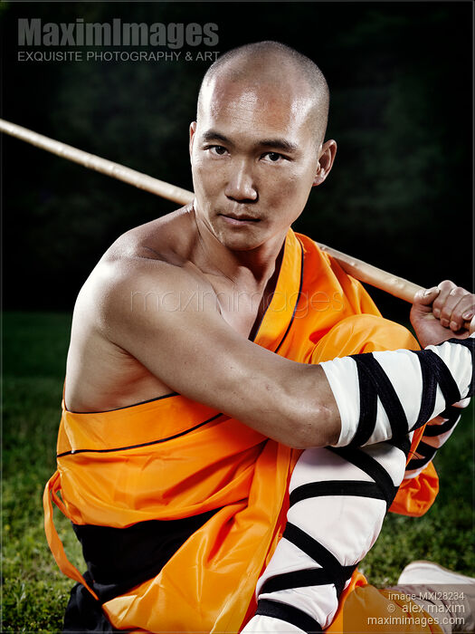 Portrait of a Shaolin monk with a staff Stock photo of Portrait of a Shaolin monk with a staff Buy commercial use license at MaximImages