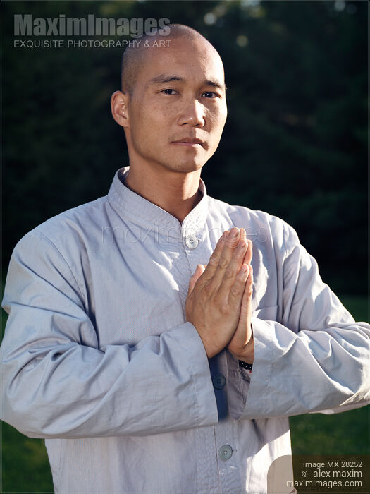 Portrait of a Shaolin warrior monk with folded hands Stock photo of Portrait of a Shaolin warrior monk with folded hands Buy commercial use license at MaximImages