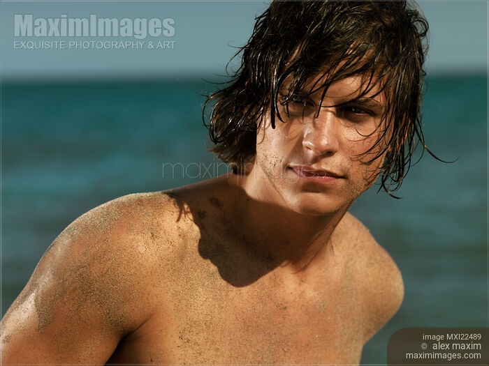 Stock photo of Portrait of a Young Man at the Sea Buy commercial use license at MaximImages