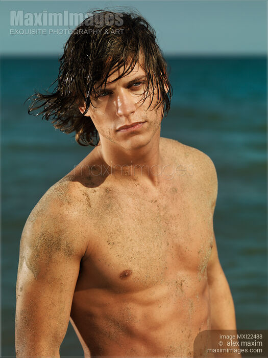 Stock photo of Portrait of a Young Man on a Sea Shore Buy commercial use license at MaximImages