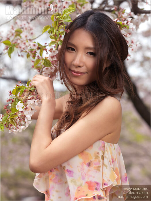 Portrait of a Young Smiling Woman Standing at a Cherry Tree Stock photo of Portrait of a Young Smiling Woman Standing at a Cherry Tree Buy commercial use license at MaximImages
