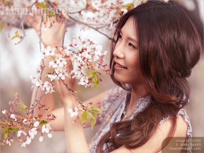 Portrait of a Young Smiling Woman Standing at a Cherry Tree Stock photo of Portrait of a Young Smiling Woman Standing at a Cherry Tree Buy commercial use license at MaximImages