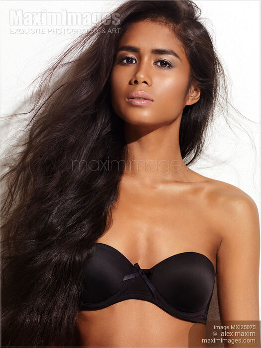 Portrait of a young woman with long hair Stock photo of Portrait of a young woman with long hair Buy commercial use license at MaximImages