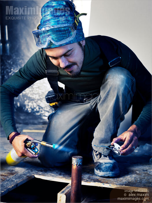 Stock photo of Portrait of man contractor worker doing plumbing Buy commercial use license at MaximImages