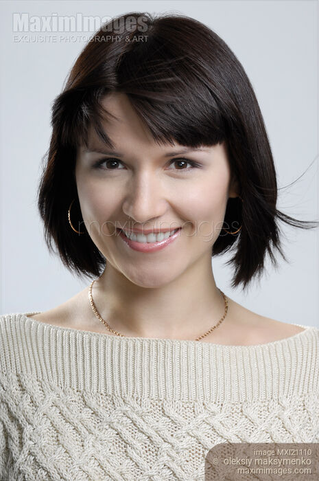 Portrait of smiling young woman Stock photo of Portrait of smiling young woman Buy commercial use license at MaximImages