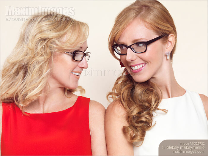 Portrait of two sisters wearing glasses Stock photo of Portrait of two sisters wearing glasses Buy commercial use license at MaximImages