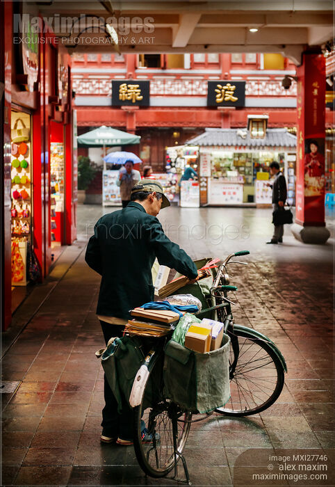 Postman in the Old city of Shanghai China Stock photo of Postman in the Old city of Shanghai China Buy commercial use license at MaximImages