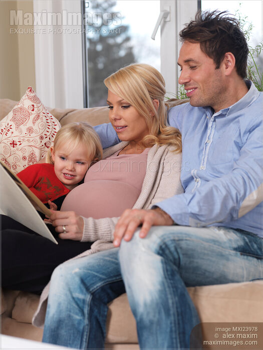 Pregnant Mother Her Husband and Daughter Together at Home Stock photo of Pregnant Mother Her Husband and Daughter Together at Home Buy commercial use license at MaximImages