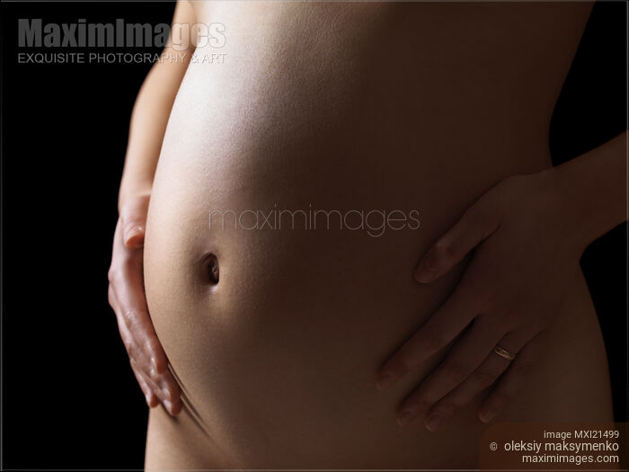 Stock photo of Pregnant Woman Belly Buy commercial use license at MaximImages