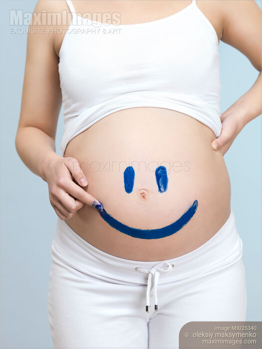 Pregnant woman belly with happy smiley Stock photo of Pregnant woman belly with happy smiley Buy commercial use license at MaximImages