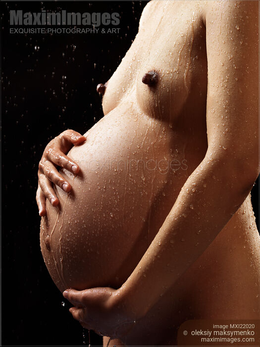 Pregnant Woman Body Under a Shower Stock photo of Pregnant Woman Body Under a Shower Buy commercial use license at MaximImages