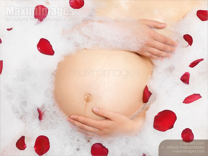 Stock photo of Pregnant Woman Taking a Bath Buy commercial use license at MaximImages