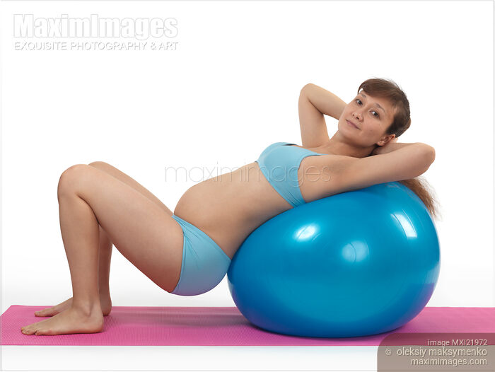 Stock photo of Pregnant Young Woman Doing Pilates Workout Buy commercial use license at MaximImages