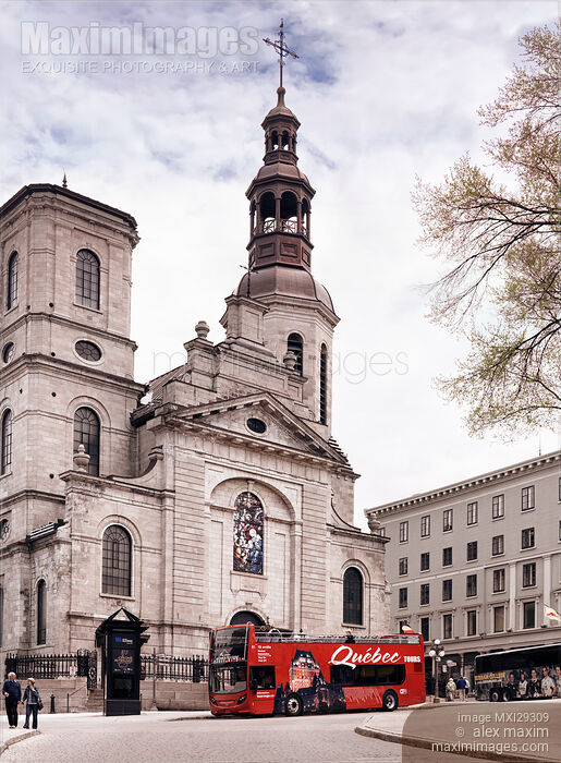 Stock photo of Quebec tours bus in front of Notre-Dame de Quebec Basilica Cathedral in Québec city Buy commercial use license at MaximImages