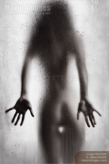 Rear view of nude sexy woman in a provocative pose standing behind wet shower glass Black and white Stock photo of Rear view of nude sexy woman in a provocative pose standing behind wet shower glass Black and white Buy commercial use license at MaximImages