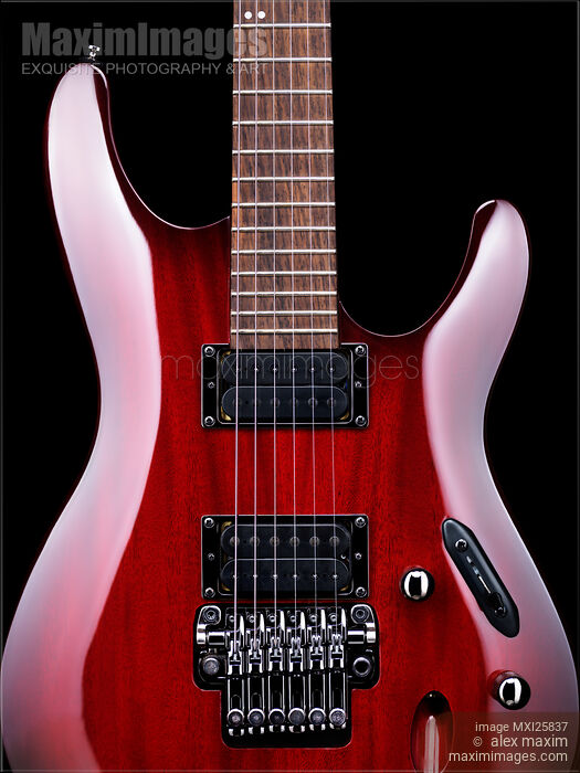 Stock photo of Red electric guitar Buy commercial use license at MaximImages