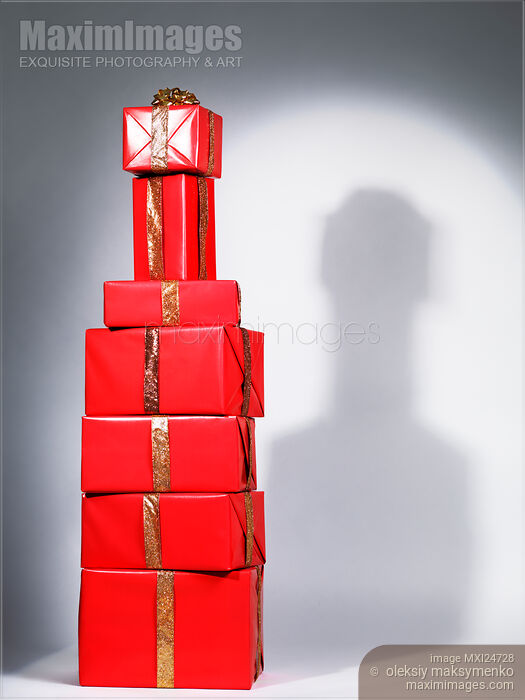 Red gift wrapped presents stacked in shape of bottle Stock photo of Red gift wrapped presents stacked in shape of bottle Buy commercial use license at MaximImages