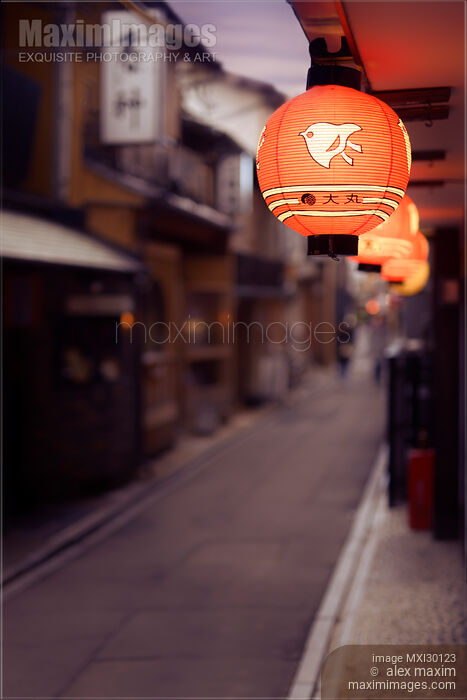 Stock photo of Red Japanese restaurant lantern lit up at night in Kyoto Buy commercial use license at MaximImages