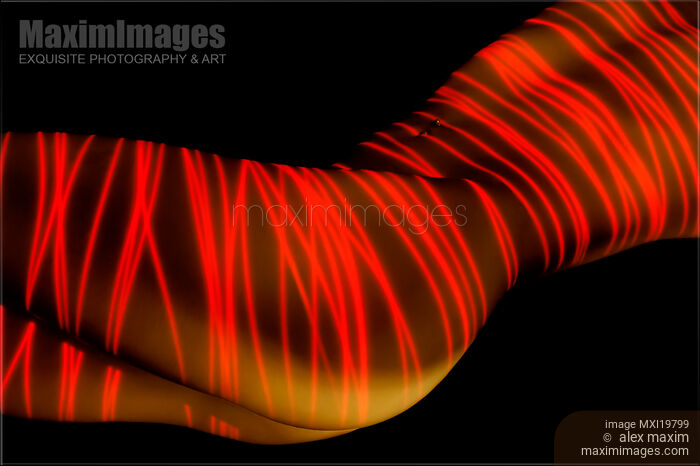Red laser over nude woman body Stock photo of Red laser over nude woman body Buy commercial use license at MaximImages