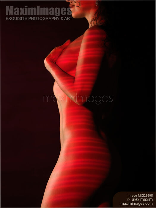 Stock photo of Red Laser stripes on naked woman body Buy commercial use license at MaximImages