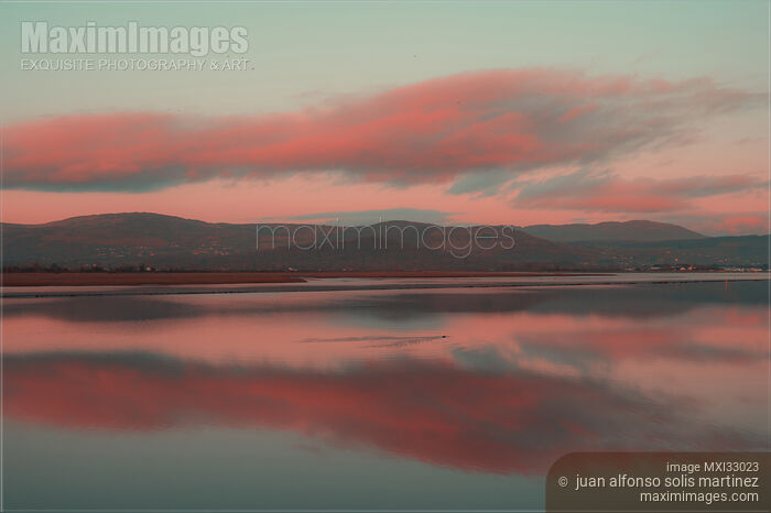 Stock photo of Red skies over Dundalk Bay at twilight tranquil nature scenery in Ireland Buy commercial use license at MaximImages
