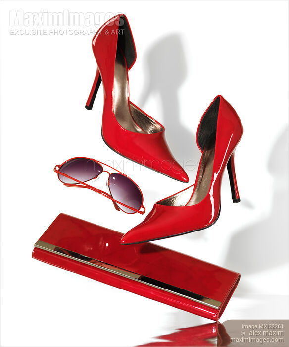 Stock photo of Red Stylish Fashion Womens Accessories Conceptual Still Life Buy commercial use license at MaximImages