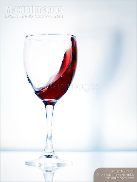 Stock photo of Red wine in a glass Buy commercial use license at MaximImages