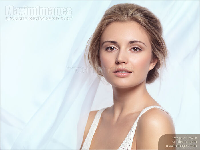 Relaxed young woman face with clean natural look Stock photo of Relaxed young woman face with clean natural look Buy commercial use license at MaximImages