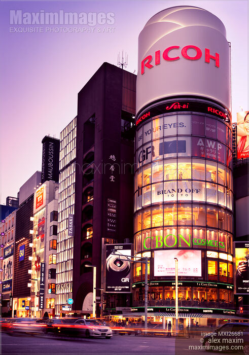 Stock photo of Ricoh building and colorful signs at twilight in Tokyo Buy commercial use license at MaximImages