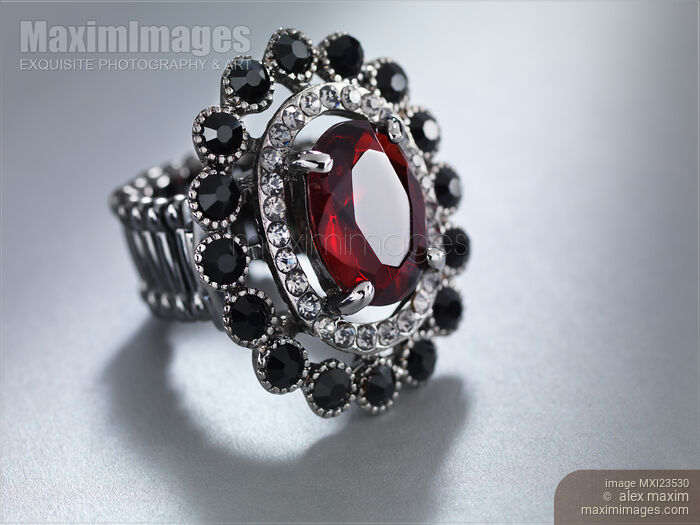 Stock photo of Ring with Red Stone Buy commercial use license at MaximImages