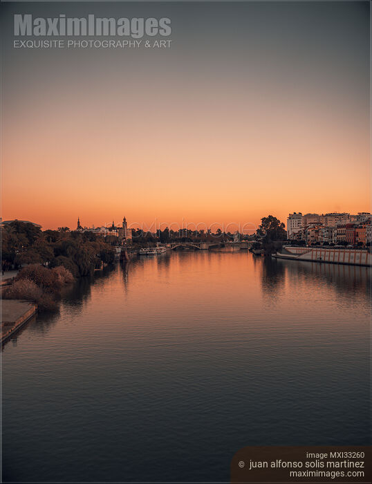 Stock photo of River Guadalquivir in Seville Spain sunset scenery Buy commercial use license at MaximImages