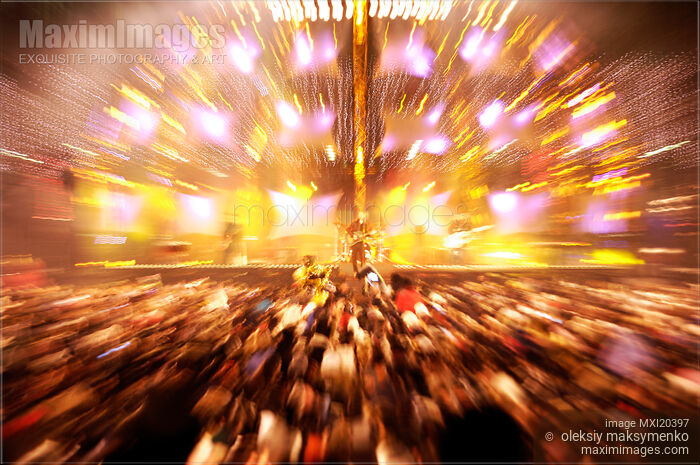 Stock photo of Rock Band Performing on a Stage Lit with Bright Lights Buy commercial use license at MaximImages
