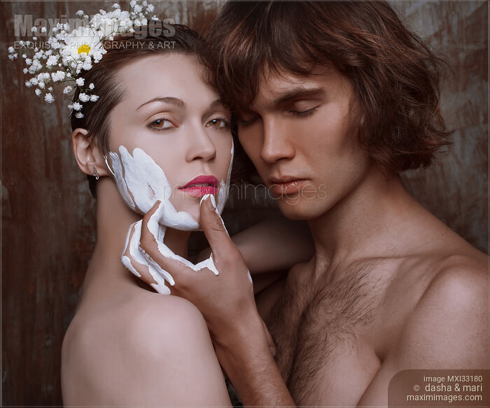 Romantic couple, an artist and a model got carried away with painting, sensual portrait Stock photo of Romantic couple, an artist and a model got carried away with painting, sensual portrait Buy commercial use license at MaximImages