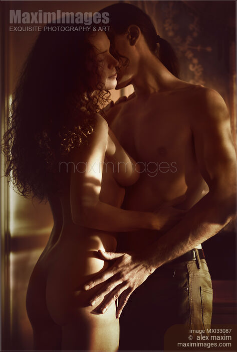 Romantic sensual art nude portrait of a nude woman and a man embracing in dim light Stock photo of Romantic sensual art nude portrait of a nude woman and a man embracing in dim light Buy commercial use license at MaximImages
