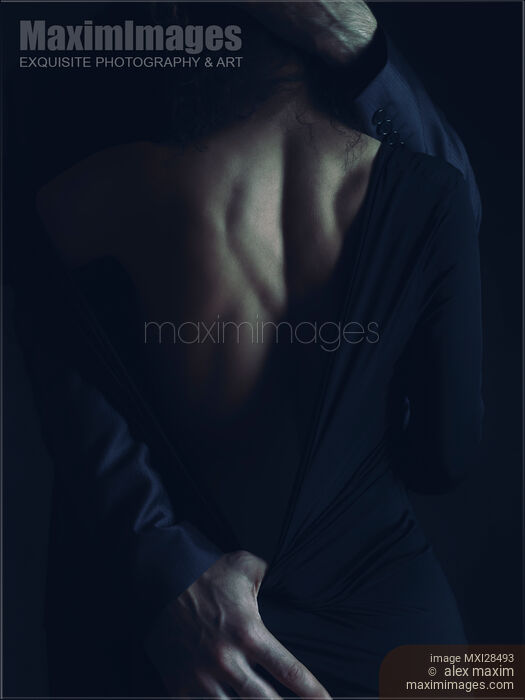 Romantic sensual portrait of couple embracing in dim night light Stock photo of Romantic sensual portrait of couple embracing in dim night light Buy commercial use license at MaximImages