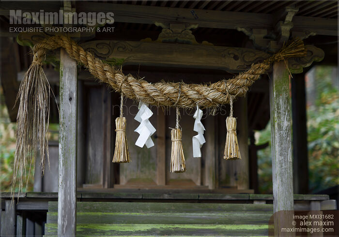 Rural Shinto shrine detail Shimenawa rope and paper Shide in Japan Stock photo of Rural Shinto shrine detail Shimenawa rope and paper Shide in Japan Buy commercial use license at MaximImages