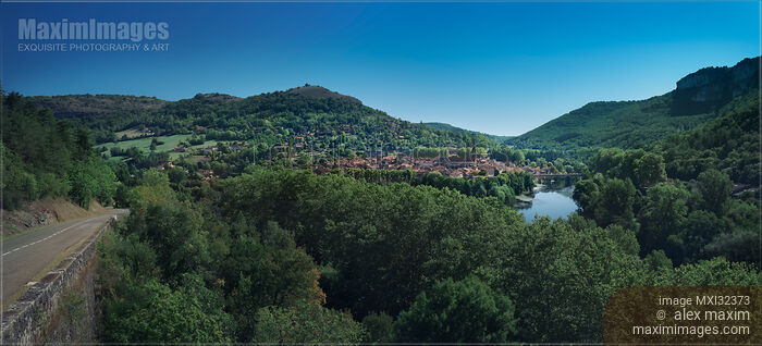 Stock photo of Saint-Antonin-Noble-Val medieval town a commune in Occitanie Southern France on river Aveyron Panoramic landscape Buy commercial use license at MaximImages